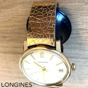 Men’s Longines watch 36mm case size with original metal watch band.